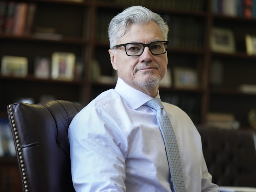 caption: Judge Juan M. Merchan poses in his chambers in New York on March 14, 2024.