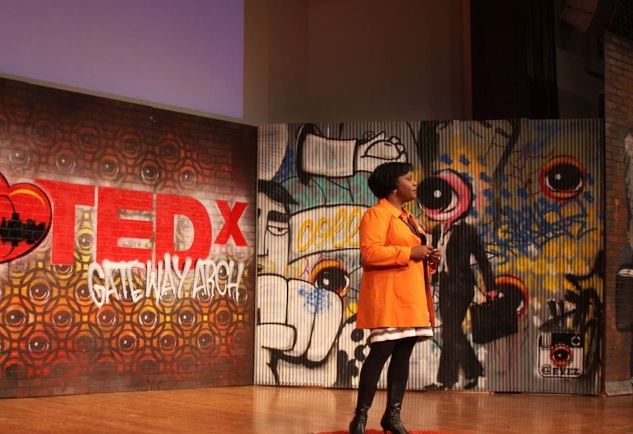 Amy Hunter on the TED stage.