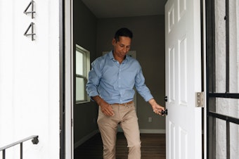 caption: Dan Valdez, housing acquisitions manager for the nonprofit Brilliant Corners, checks out a recently leased property near downtown Los Angeles.