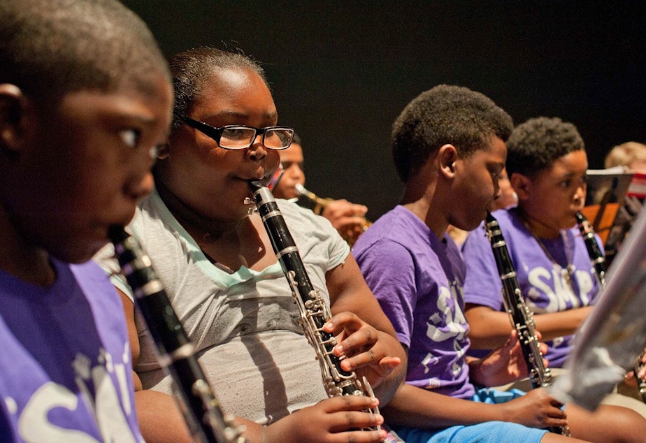 caption: Seattle Music Partners students provides free instruction and instruments to students at low-income schools. The hope is to level the playing field at Washington Middle School and Garfield High, which have renowned music programs.