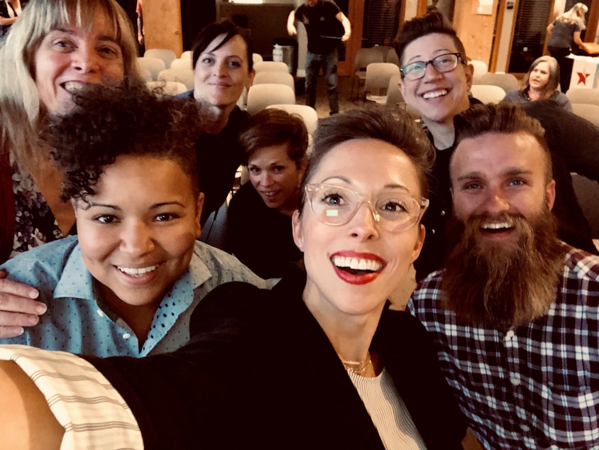 caption: Queeriosity Club members pose for a selfie at The Impact Hub in Seattle following KUOW's program with LGBTQ activists Jodie Patterson and Spencer Bergstedt. June 7, 2019. From left, back row: Jennifer Hegeman, Christine Cox, Dacia Clay, Keri Zierler. Front row: Mellina White Cusack, KUOW producer Kristin Leong, Jeffrey Howard. 