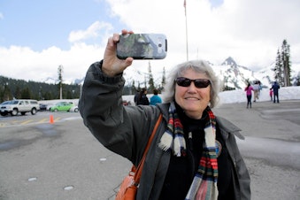 caption: Geologist Carolyn Driedger outside the visitor center at Mount Rainier National Park. 