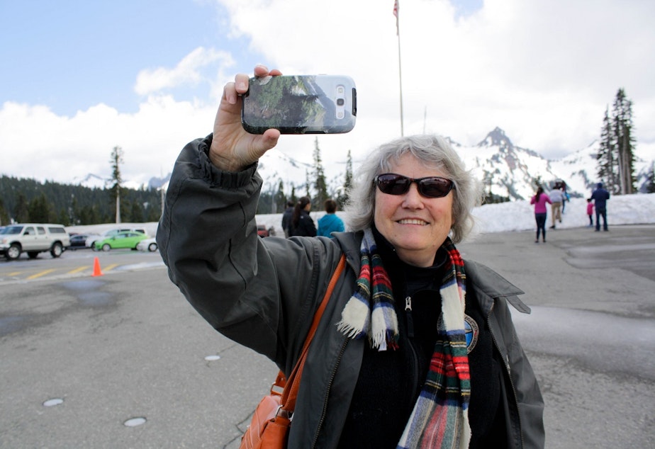 caption: Geologist Carolyn Driedger outside the visitor center at Mount Rainier National Park. 