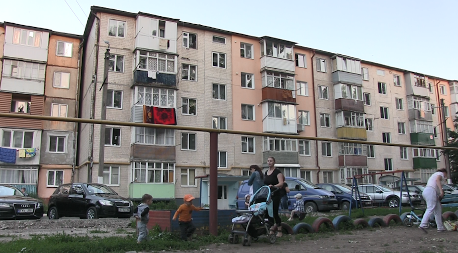 caption: Children play in a neighborhood in Moldova.