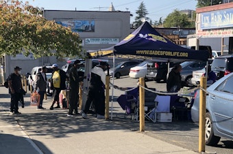 caption: Renegades for Life Youth Outreach, a nonprofit organization, hosts weekly street outreach pop-ups at 12th and Jackson in Seattle's Chinatown-International District on Friday, September 30, 2022.