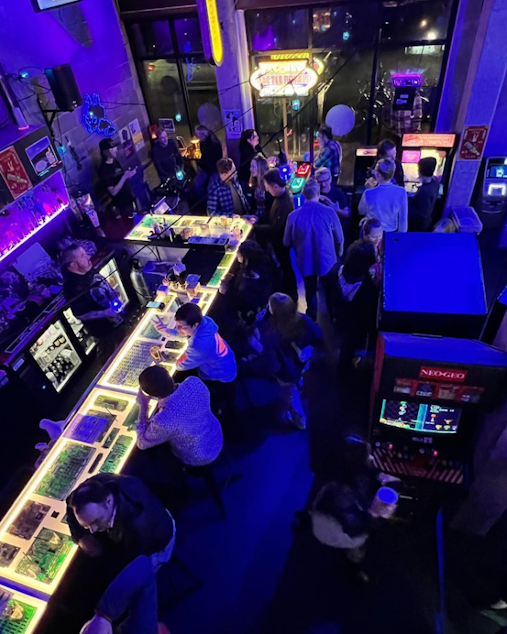 caption: Pop culture and nightlife collide at the Time Warp arcade bar in Seattle's Capitol Hill neighborhood. With art, cyberpunk lighting, and a ramen bar, Time Warp is themed after sci-fi classics (mainly "Blade Runner"). 