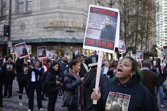 caption: Marchers in Seattle protested the killing of Che Taylor in February 2016.