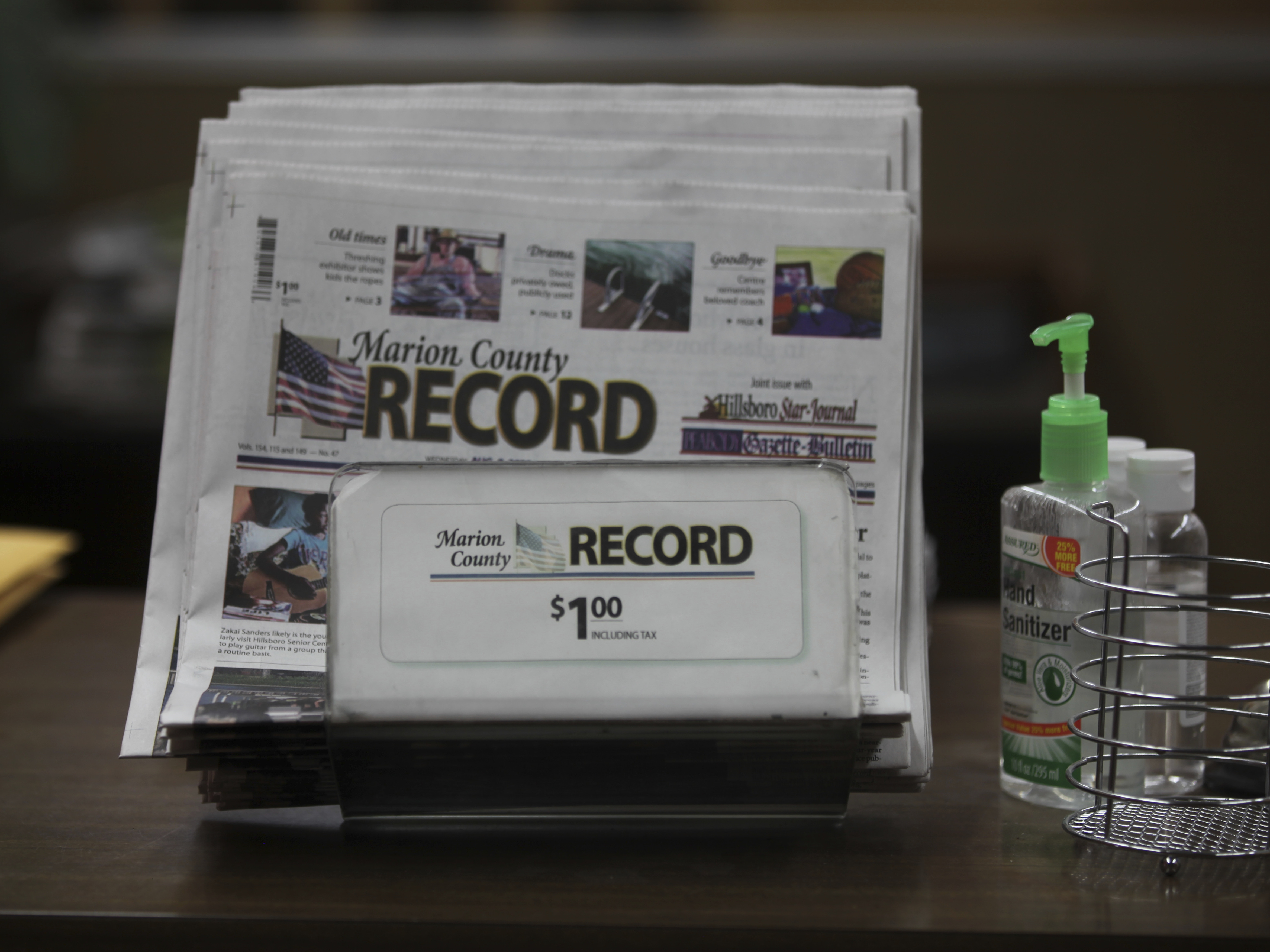 caption: The last printed issue of the Marion County Record sits in a display in its office, Sunday, Aug. 13, 2023, in Marion, Kan. Editor and Publisher Eric Meyer says the newspaper will publish its regular weekly issue on Aug. 16, 2023, despite a raid by local law enforcement officers and the seizure of computers and cell phones. (AP Photo/John Hanna)
