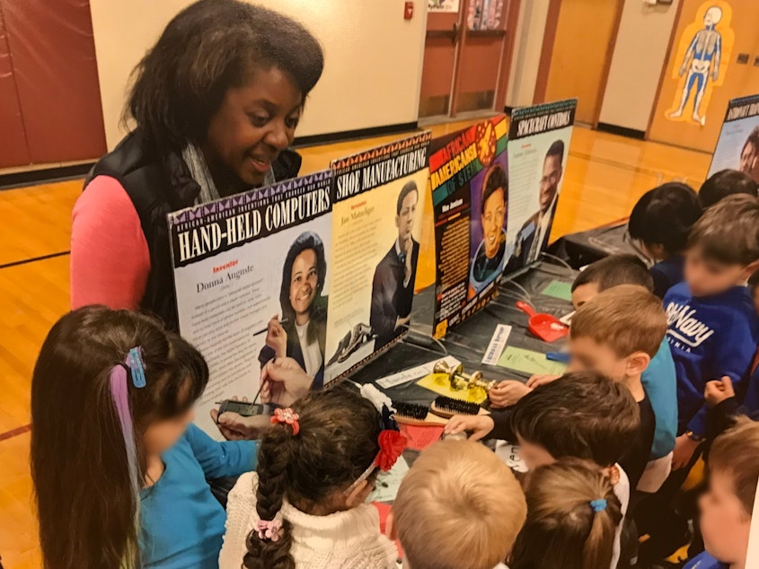 caption: Fernell Miller teaching Black history to elementary students. Her after school program serves youth from kindergarten up through high school.
