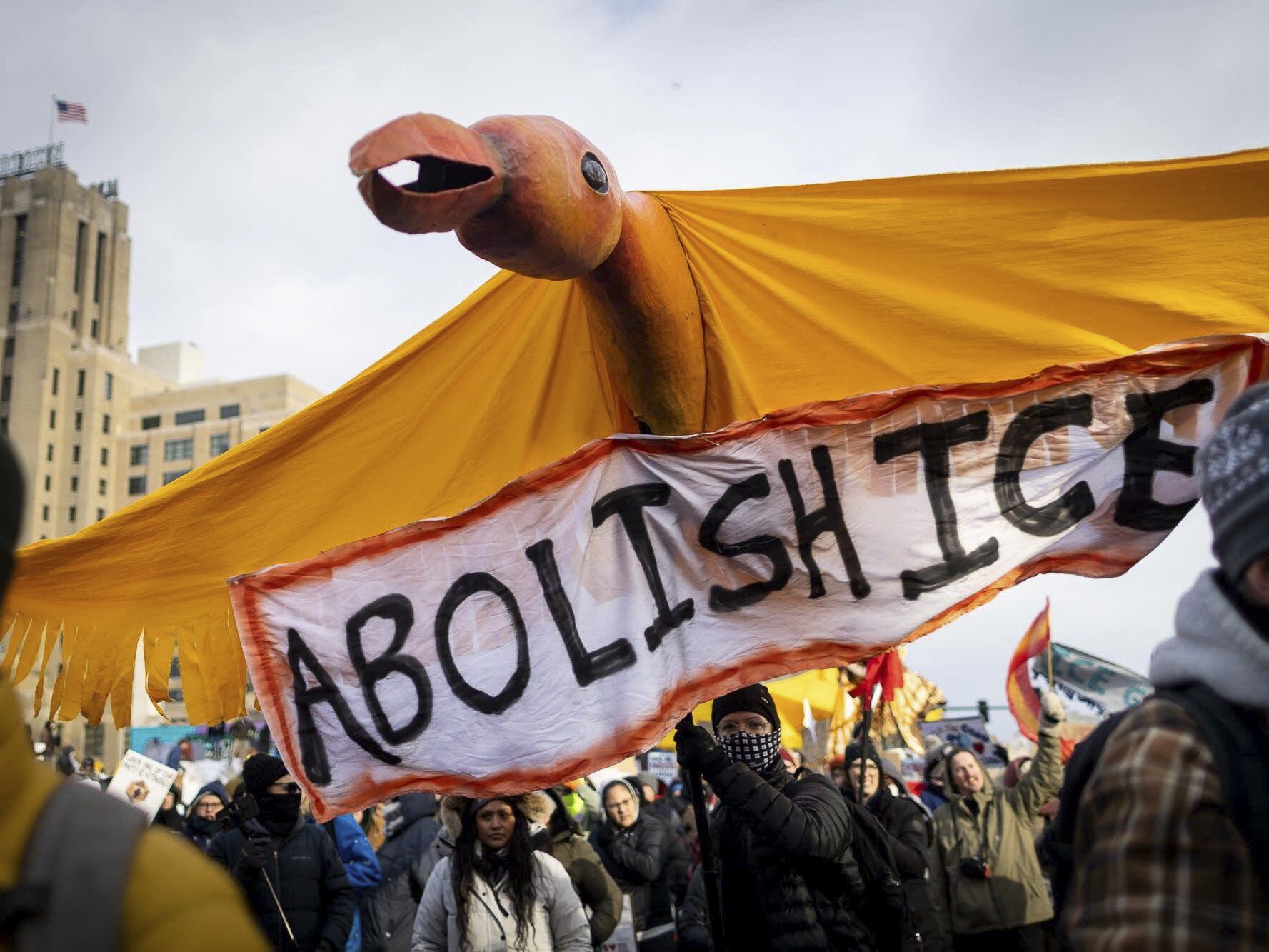 caption: A large bird puppet crafted at In the Heart of the Beast Puppet and Mask Theatre in Minneapolis is carried down Lake Street during a march demanding ICE's removal from Minnesota on Saturday, Jan. 10, 2026.