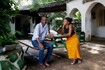 caption: From Burey: "I met Joe in Liwonde, Malawi on Saturday, February 7, 2015. I accidentally went to Green Bird Restaurant, owned by his sister, and asked for directions to Green Bird Bar (featured in photo). After I left the restaurant to start off on my way, Joe found me and walked with me around the market, as instructed by his mother. He told me this story over a beer. Joe is 42 years old and has one son who lives in Blantyre.