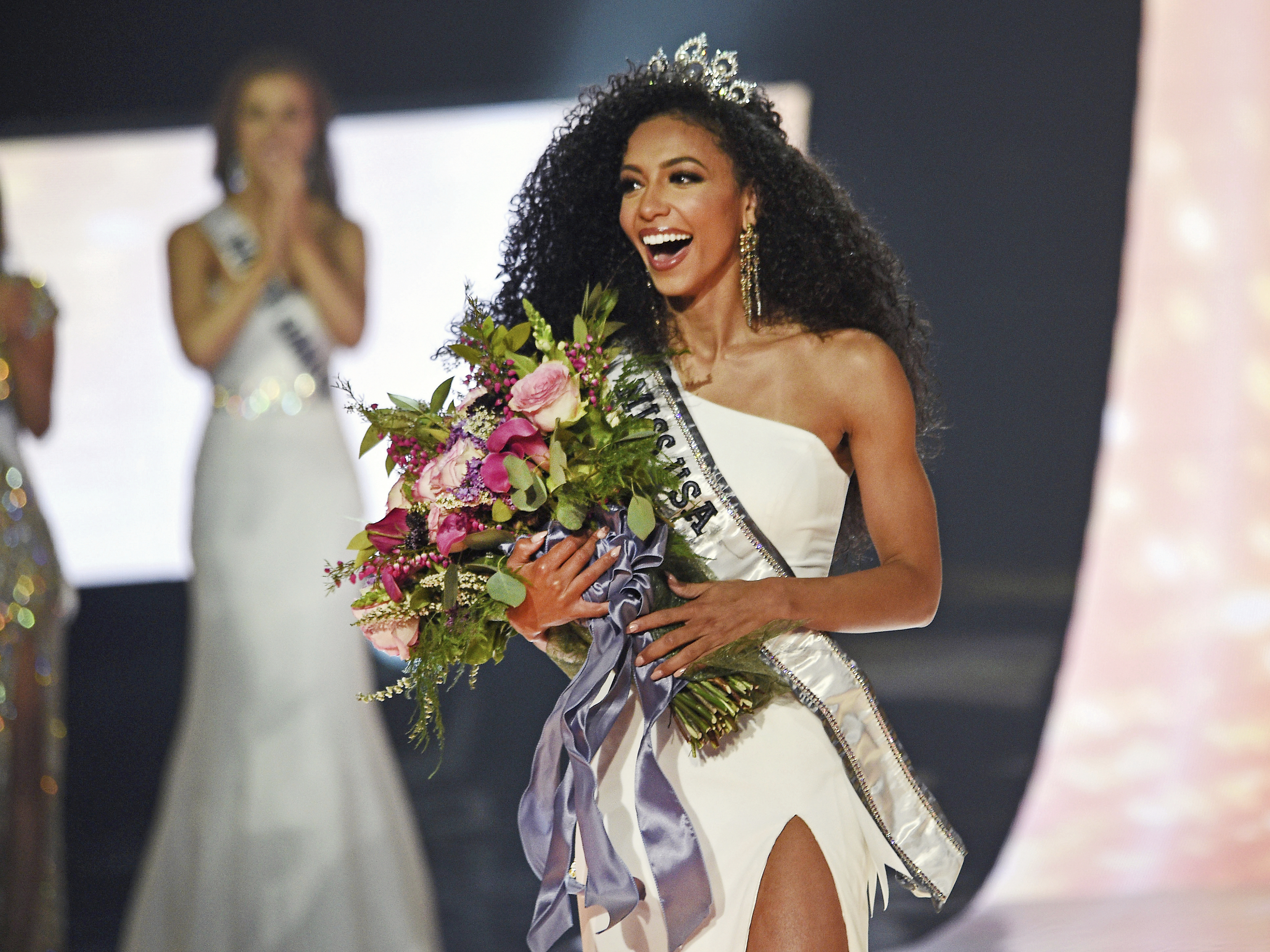 caption: Miss North Carolina Cheslie pictured as she Kryst wins the 2019 Miss USA final competition in Reno, Nev., in 2019. Kryst, a correspondent for the entertainment news program <em>Extra</em>, has died at age 30.