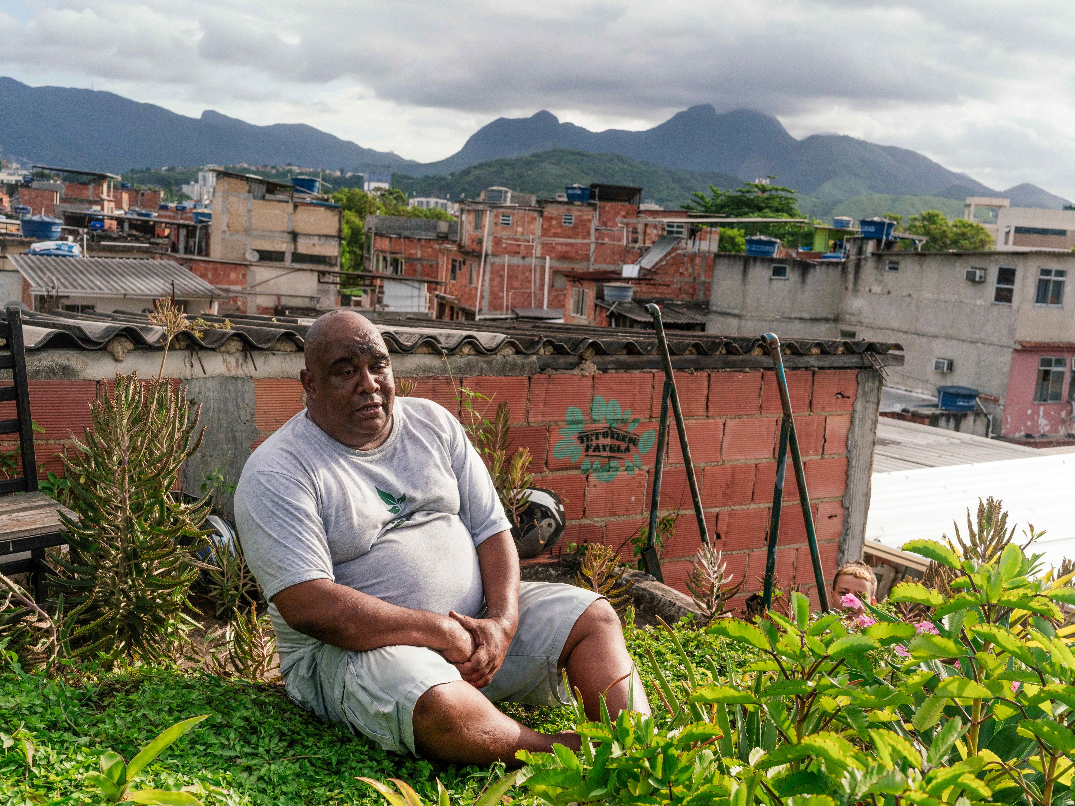 caption: Luis Cassiano is the founder of Teto Verde Favela, a nonprofit that teaches favela residents in Rio de Janeiro, Brazil, how to build their own green roofs as a way to beat the heat. He's photographed at his house, which has a green roof.