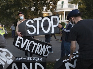 caption: Housing activists in Swampscott, Mass., on Oct. 14, 2020. A congressional report finds that four corporate landlords acted aggressively to push out tenants during the first year of the pandemic, despite a federal eviction moratorium and billions in emergency rental aid.