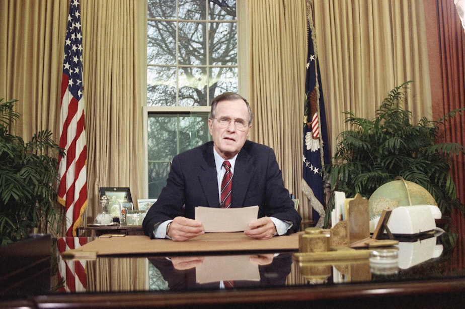 caption: President George H.W. Bush addressing the nation on television from the Oval Office in Washington, D.C., on Wednesday, Dec. 20, 1989 explaining his decision to deploy American troops to Panama. 