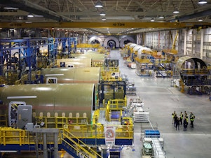 caption: The FAA says it's investigating Boeing after some required inspections of the 787 Dreamliner were not performed as required. Dreamliners are shown under production at Boeing's manufacturing facility in North Charleston, S.C.