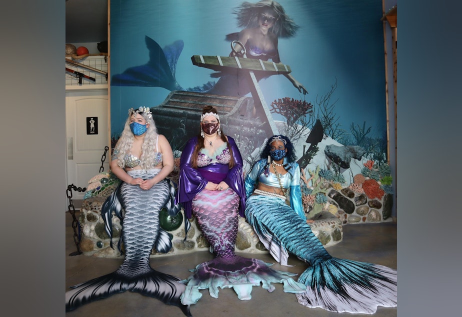 caption: From left, Mermaid Siren Ophelia of Seattle, Mermaid Asherah and Mermaid Merina both of Portland, at the opening of the new International Mermaid Museum near Aberdeen, Washington.