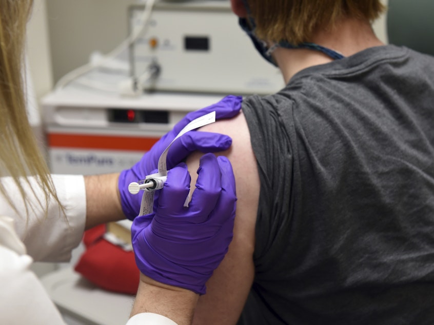 caption: The first patient enrolled in Pfizer's COVID-19 coronavirus vaccine clinical trial at the University of Maryland School of Medicine in Baltimore received an injection in May.