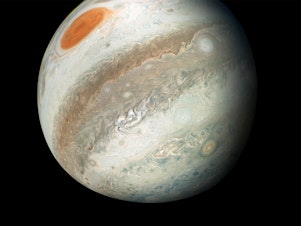 caption: This new perspective of Jupiter from the south makes the Great Red Spot appear as though it is in northern territory. This view is unique to Juno.