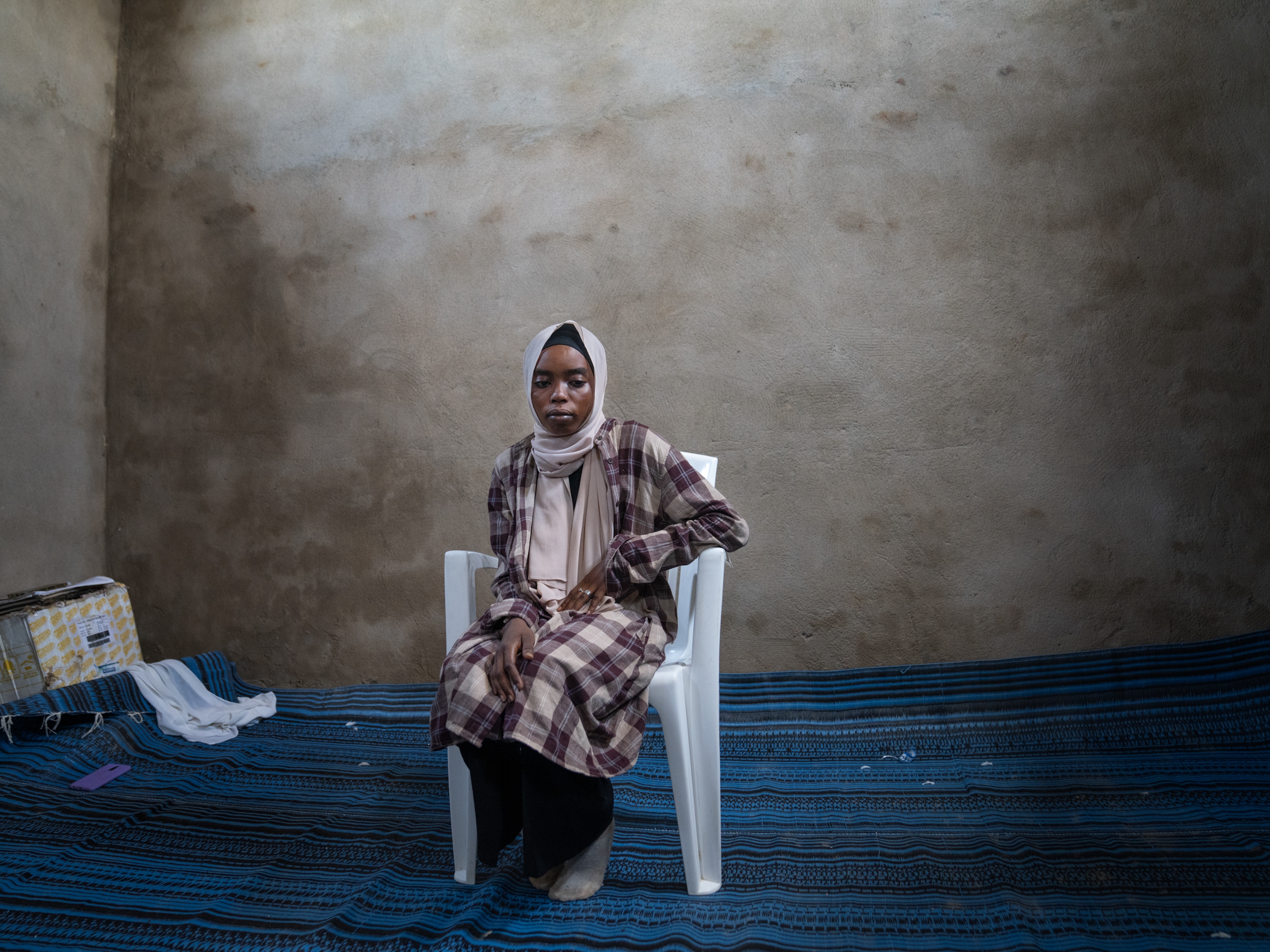 caption: Abrar Saleh Ali, 17, arrived at the Milé refugee camp in Eastern Chad in early September, after the civil war in Sudan destroyed her home and she was separated from her family.  (Her dad had died earlier from an illness.) It took months for her to walk across the country and reach the camp. Along the way she was robbed of all her belongings and found out that her sister had been killed.<strong> </strong>
