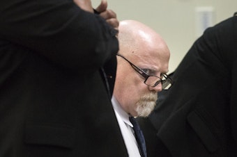 caption: William Talbot II looks around the courtroom during the first day of jury selection in his trial. He is accused of the 1987 murders of Tanya van Cuylenborg and Jay Cook.