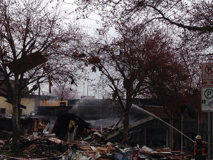 caption: Debris litters nearby trees after a gas leak explosion in Seattle's Greenwood neighborhood in the early hours of Wed., March 9, 2016.