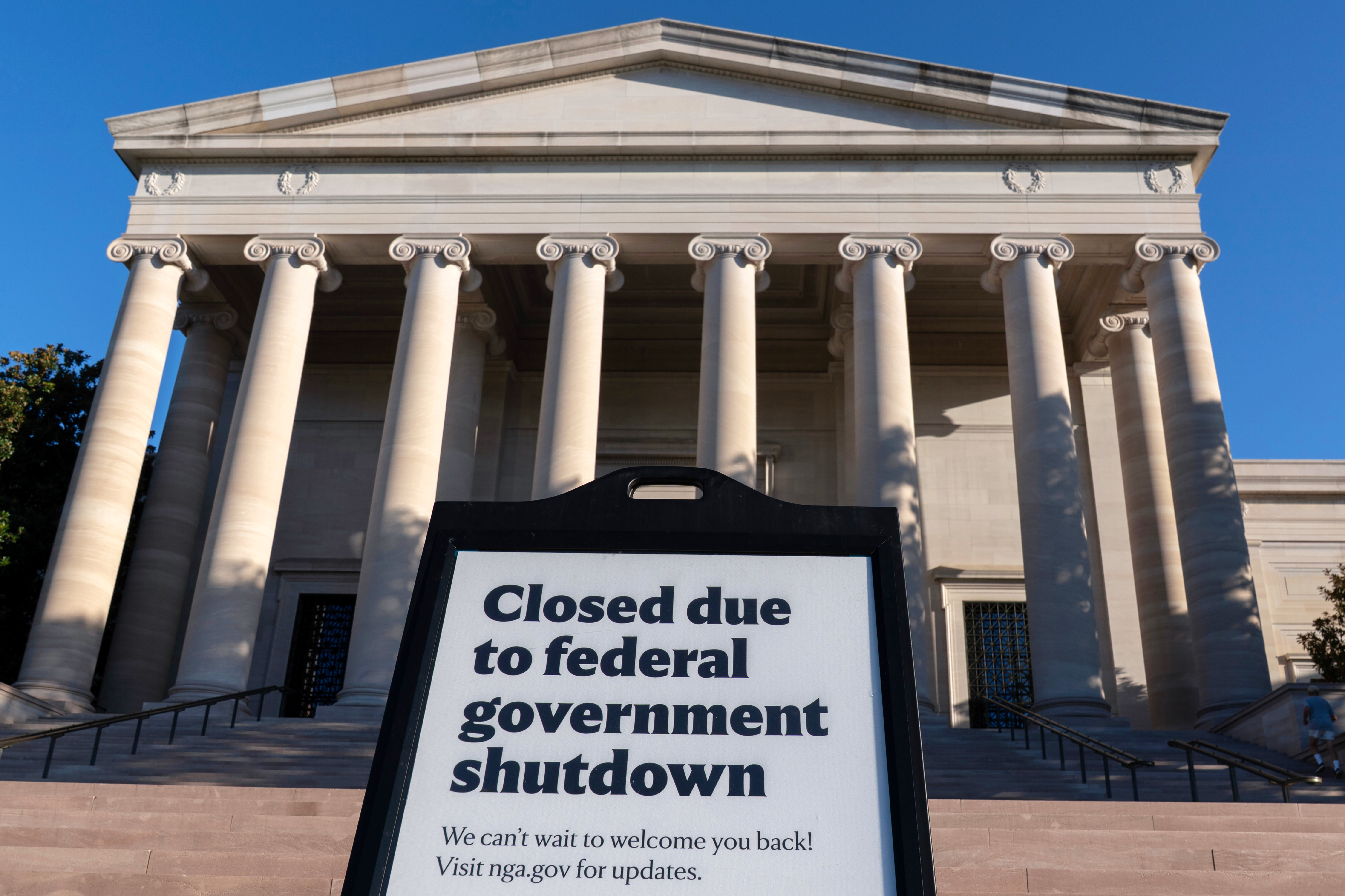 caption: A sign that reads "Closed due to federal government shutdown," is seen outside of the National Gallery of Art on the 6th day of the government shutdown, in Washington, Monday, Oct. 6, 2025. 