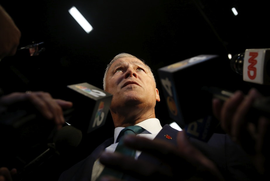 caption: Democratic presidential candidate Washington Gov. Jay Inslee, speaks to the press before the start of the Democratic primary debate hosted by NBC News at the Adrienne Arsht Center for the Performing Art, Wednesday, June 26, 2019, in Miami. 