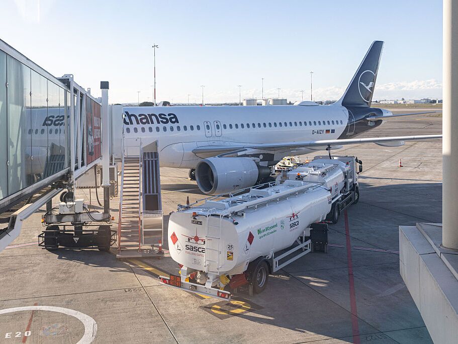 caption: A Lufthansa passenger jet refuels at the gate at Toulouse-Blagnac Airport in France in March, 2026.