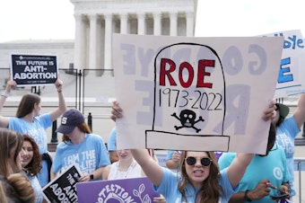 caption: Demonstrators protest about abortion outside the Supreme Court in Washington, June 24, 2022. In the year since, approximately 22 million women, girls and other people of reproductive age now live in states where abortion access is heavily restricted or totally inaccessible.