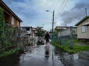 caption: Streets remained flooded in Cataño, Puerto Rico the day after Hurricane Fiona made landfall on the island.