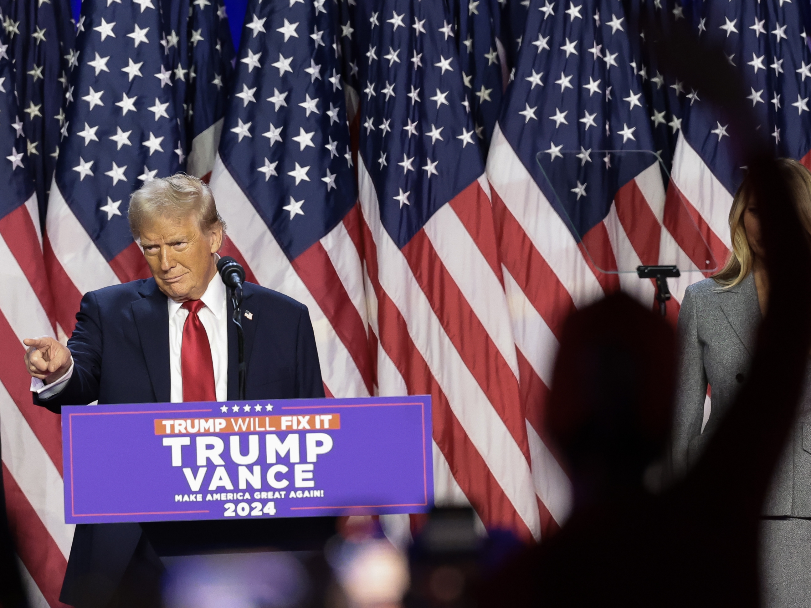 caption: Republican presidential nominee, former U.S. President Donald Trump arrives to speak during an election night event at the Palm Beach Convention Center on November 06, 2024 in West Palm Beach, Florida.