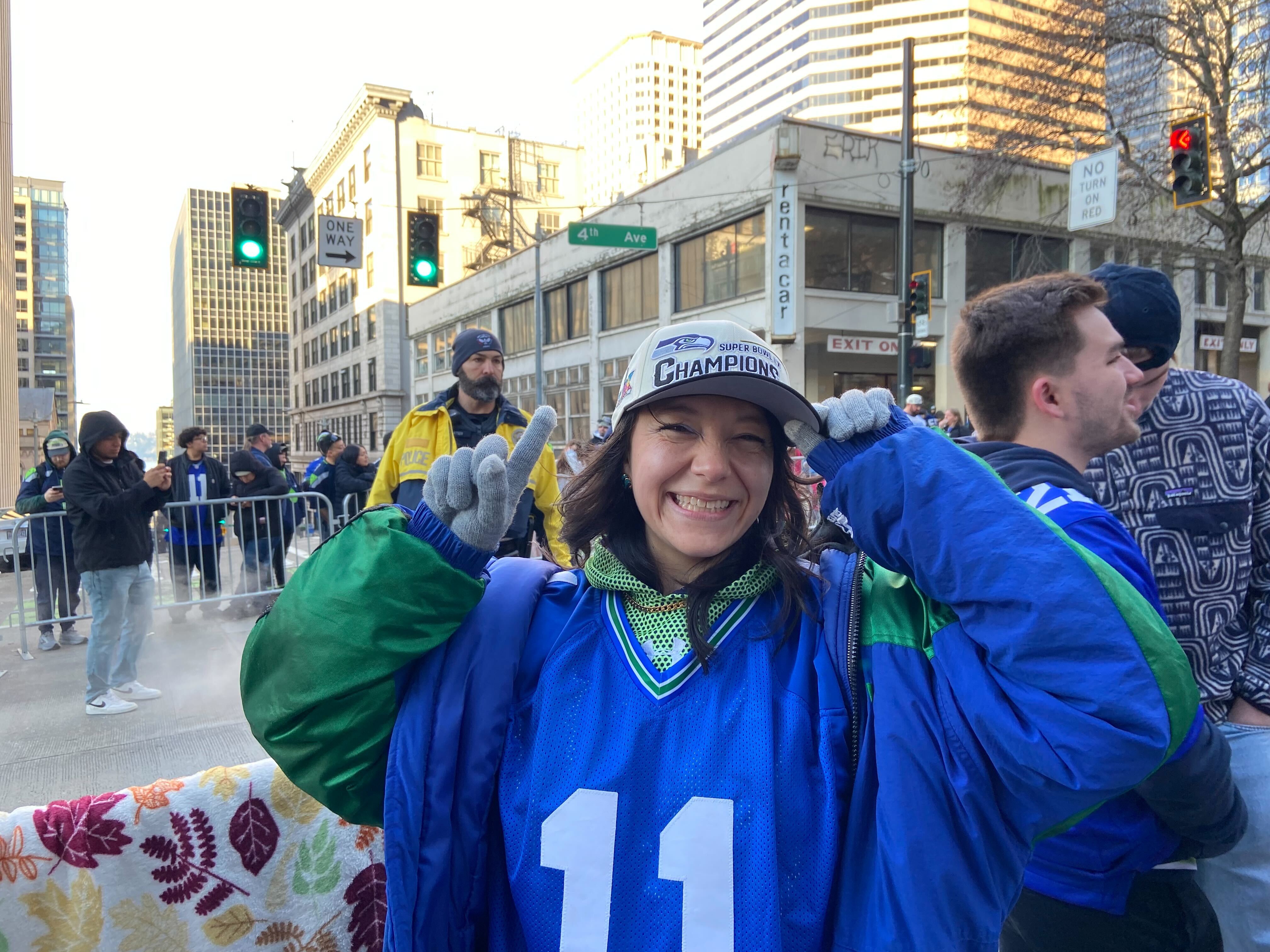caption: Seattle Seahawks fan Serenna Duncan took a day off from work to attend the Super Bowl LX celebration in downtown Seattle on Wednesday, February 11, 2026.