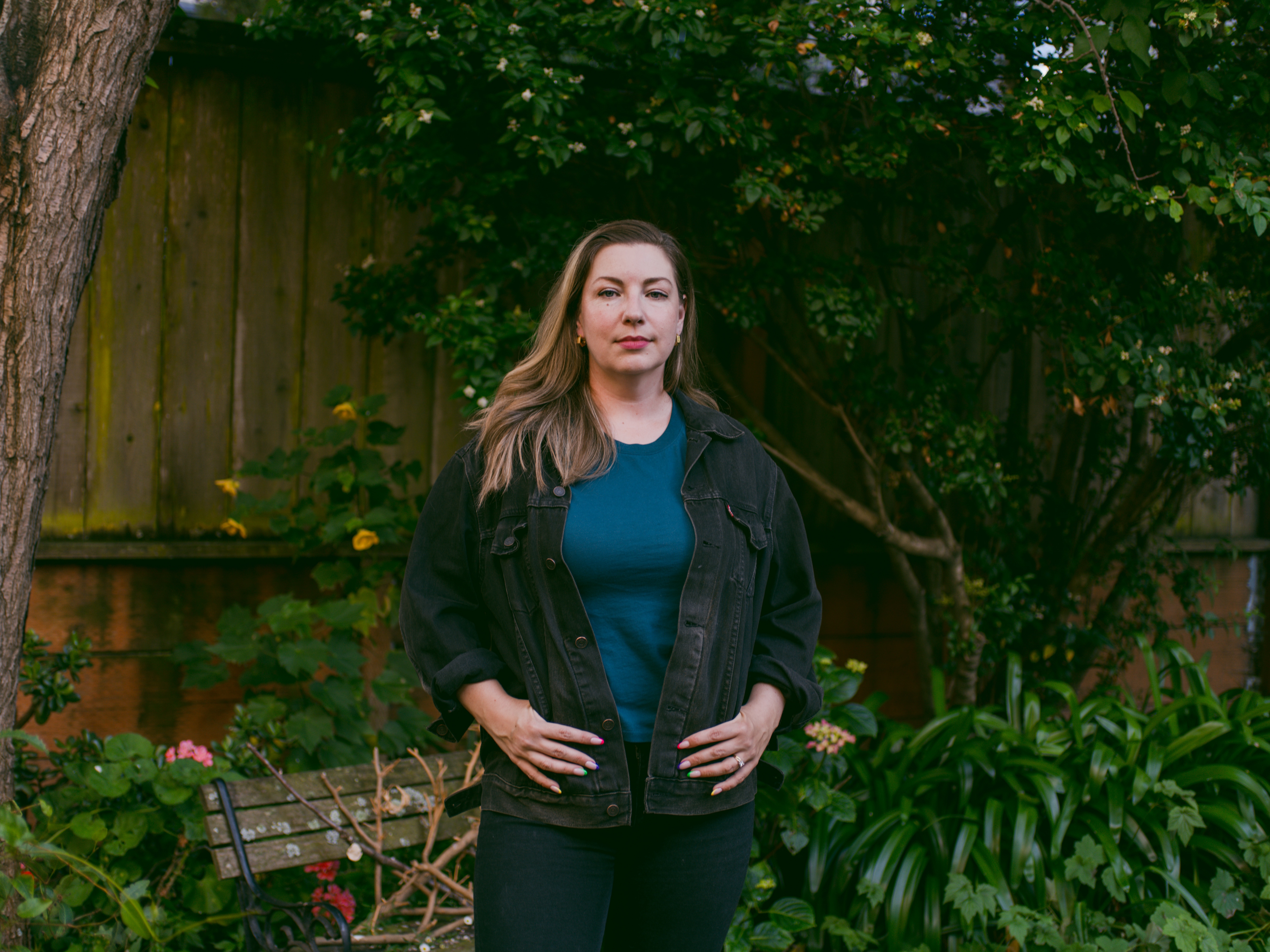caption: Emily Baden stands in her backyard in San Francisco. Before moving to San Francisco, she was neighbors with Supreme Court Justice Samuel Alito, who she says was a quiet observer to heated exchanges between her and Alito’s wife, Martha-Ann Alito, regarding signs on the Baden family’s front yard.
