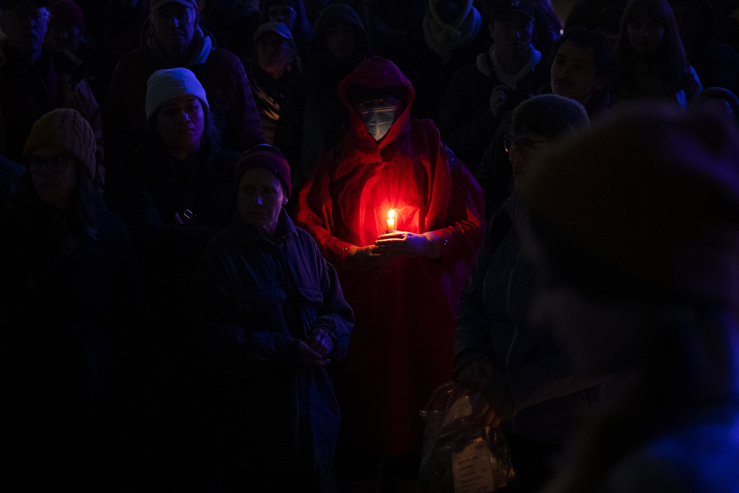 caption: Hundreds of Seattleites took part in a vigil and march to honor Renee Nicole Good, the Minneapolis mother of three who was shot in the head and killed by an ICE agent earlier this week, on Thursday, January 8, 2026, at Pier 58 in Seattle. 