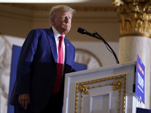 caption: Former President Donald Trump speaks at his Mar-a-Lago estate on April 4, in Palm Beach, Fla.