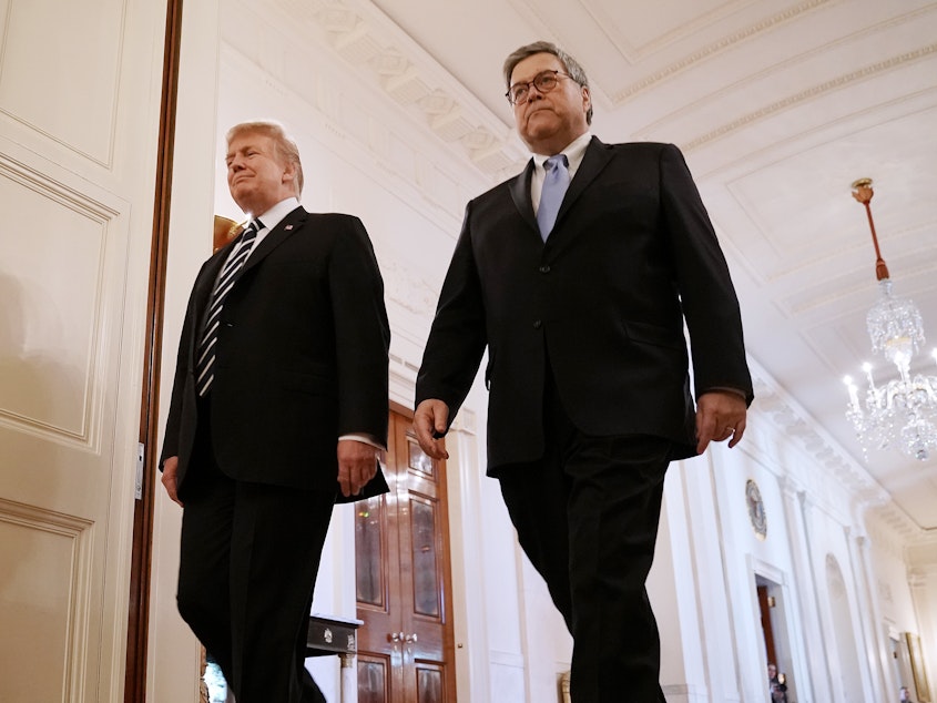 caption: President Trump and Attorney General William Barr attend an event at White House on Wednesday. Trump has empowered Barr to investigate the origins of the special counsel probe and reveal his findings.