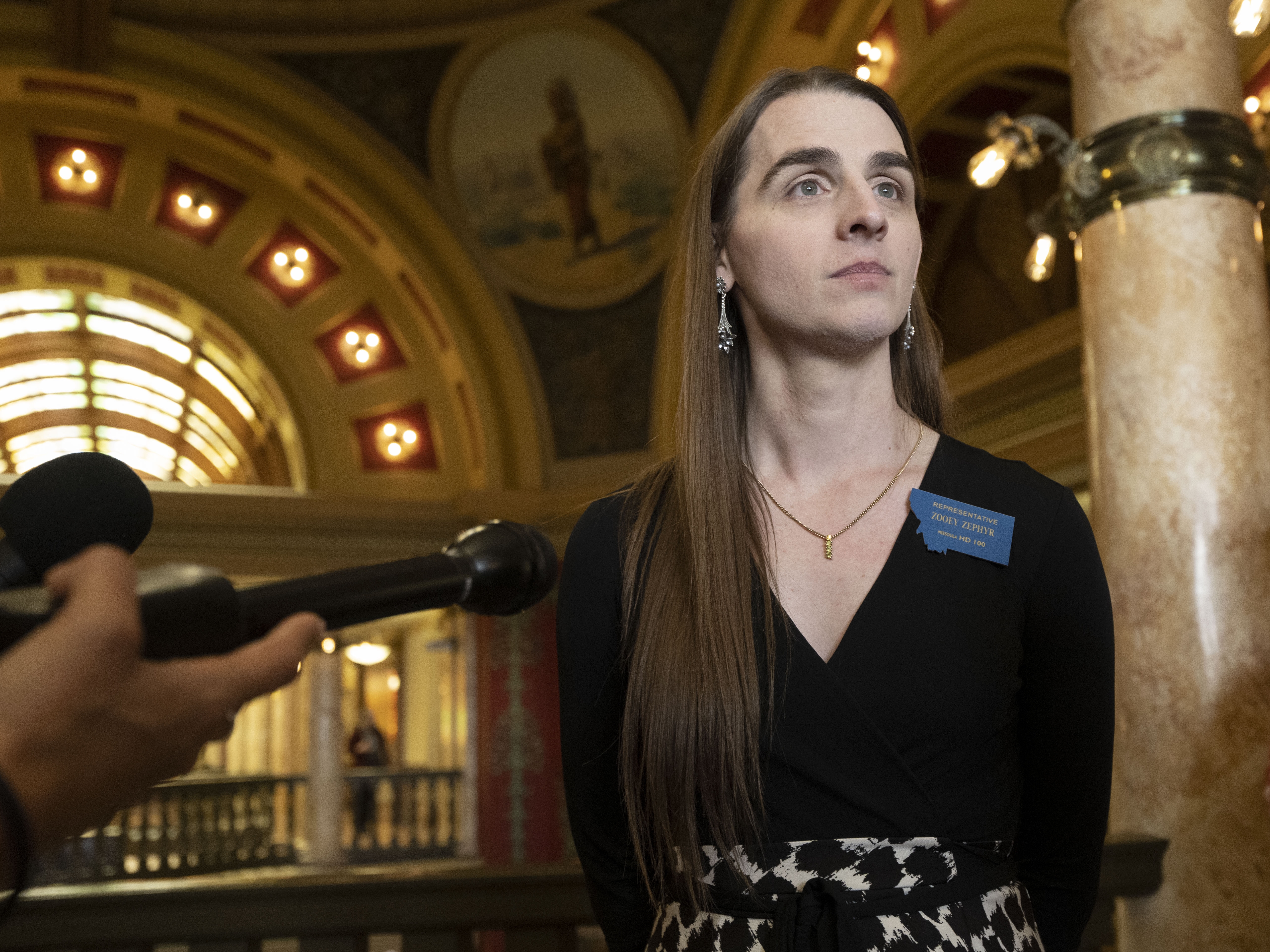 caption: Openly transgender Rep. Zooey Zephyr, pictured at the Montana State Capitol in Helena, Mont., in 2023, was reelected last month. This week, her colleagues debated a rule that would have blocked her from the women's restroom at the Capitol.