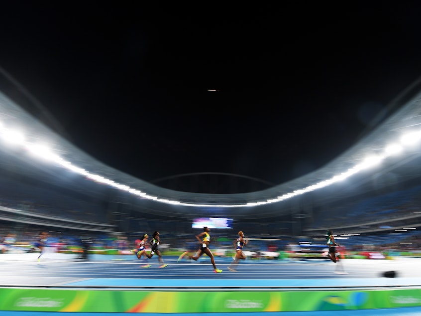 caption: Roughly 35 bills are being proposed that would limit or prohibit transgender women from competing in women's athletics. Above, athletes run in the Women's 400 meter final during the Rio 2016 Olympic Games.