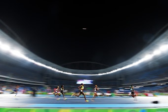 caption: Roughly 35 bills are being proposed that would limit or prohibit transgender women from competing in women's athletics. Above, athletes run in the Women's 400 meter final during the Rio 2016 Olympic Games.