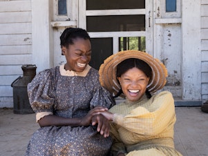 caption: Young Celie (Phylicia Pearl Mpasi) and young Nettie (Halle Bailey) share an unbreakable bond.