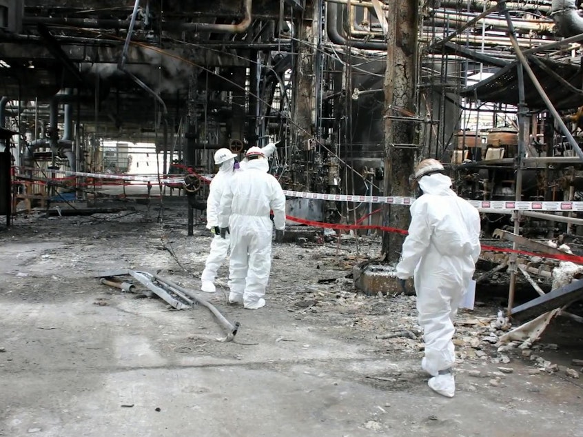 caption: Chemical Safety Board investigators inspect wreckage at the Tesoro-Anacortes refinery in 2010.