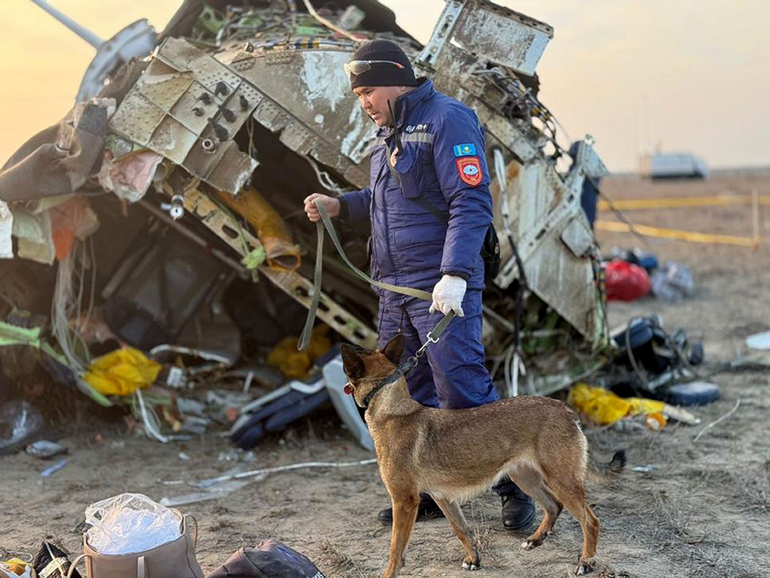 caption: In this photo released by Kazakhstan's Emergency Ministry Press Service, rescuers work at the wreckage of Azerbaijan Airlines Embraer 190 lays on the ground near the airport of Aktau, Kazakhstan, Thursday.