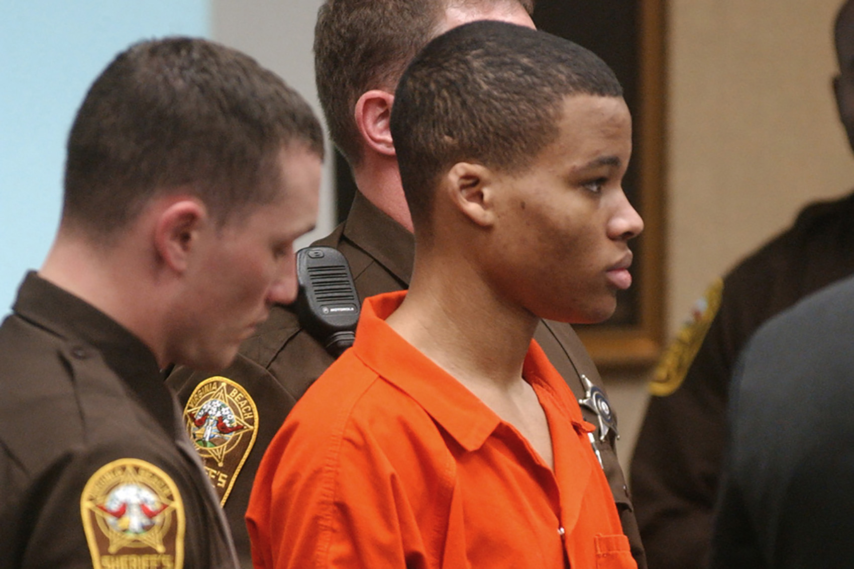caption: In this Oct. 20, 2003 file photo, Lee Boyd Malvo listens to court proceedings during the trial of fellow sniper suspect John Allen Muhammad in Virginia Beach, Va. An attorney for Malvo, convicted as a teenager of taking part in deadly sniper attacks that terrorized the Washington area, will argue before a Maryland judge that his young client’s life sentence is unconstitutional and should be thrown out. (Martin Smith-Rodden, Pool, File/AP)