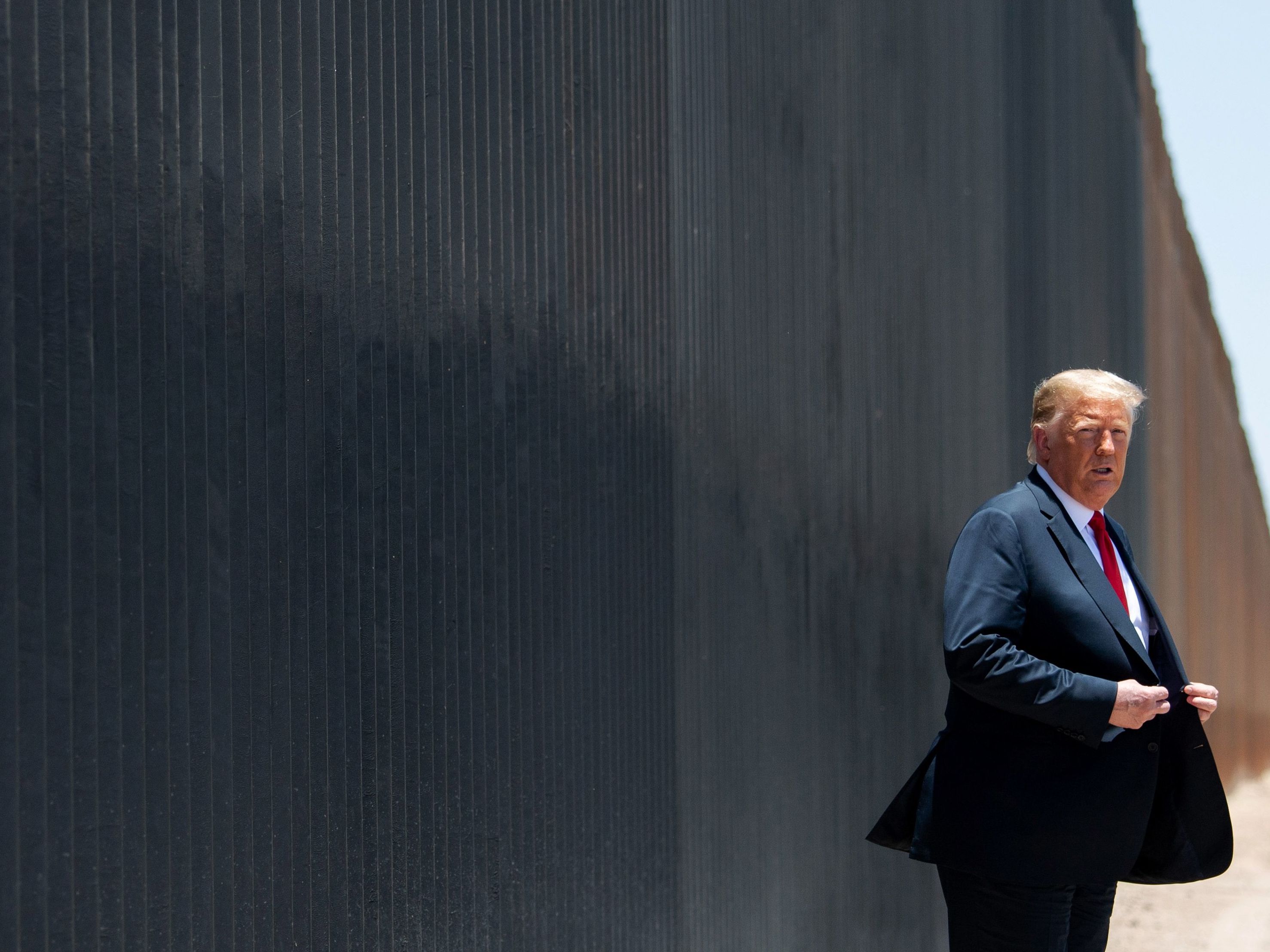 caption: President Trump participates in a ceremony commemorating the 200th mile of border wall at the international border with Mexico in San Luis, Ariz., on June 23, 2020.