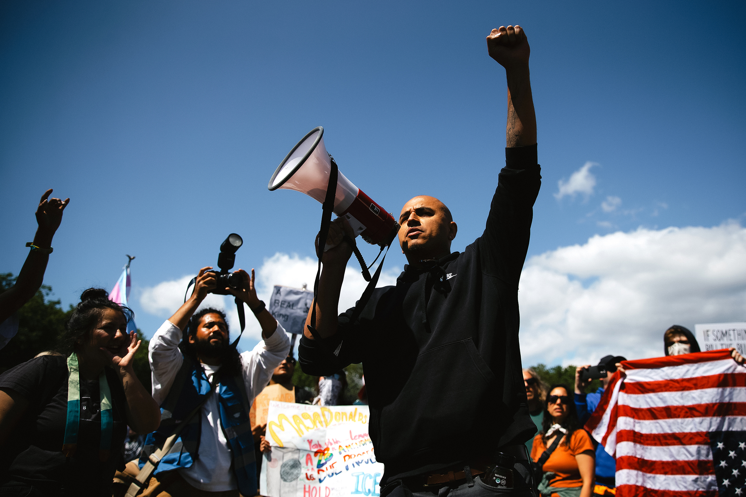 caption: Ricardo Heredia Romero leads a chant among demonstrators on Saturday, June 14, 2025, during the ‘No Kings’ protest at Seattle Center. Protesters fanned across Seattle as part of the national No Kings demonstrations opposing President Donald Trump's immigration raids and ICE policies.