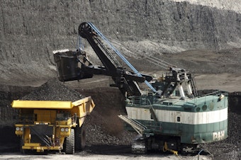 caption: FILE - A mechanized shovel loads a haul truck that can carry up to 250 tons of coal at the Spring Creek coal mine, April 4, 2013, near Decker, Mont. On Wednesday, Feb. 21, 2024, a U.S. appeals court struck down a judge's 2022 order that imposed a moratorium on coal leasing from federal lands. (AP Photo/Matthew Brown, File)