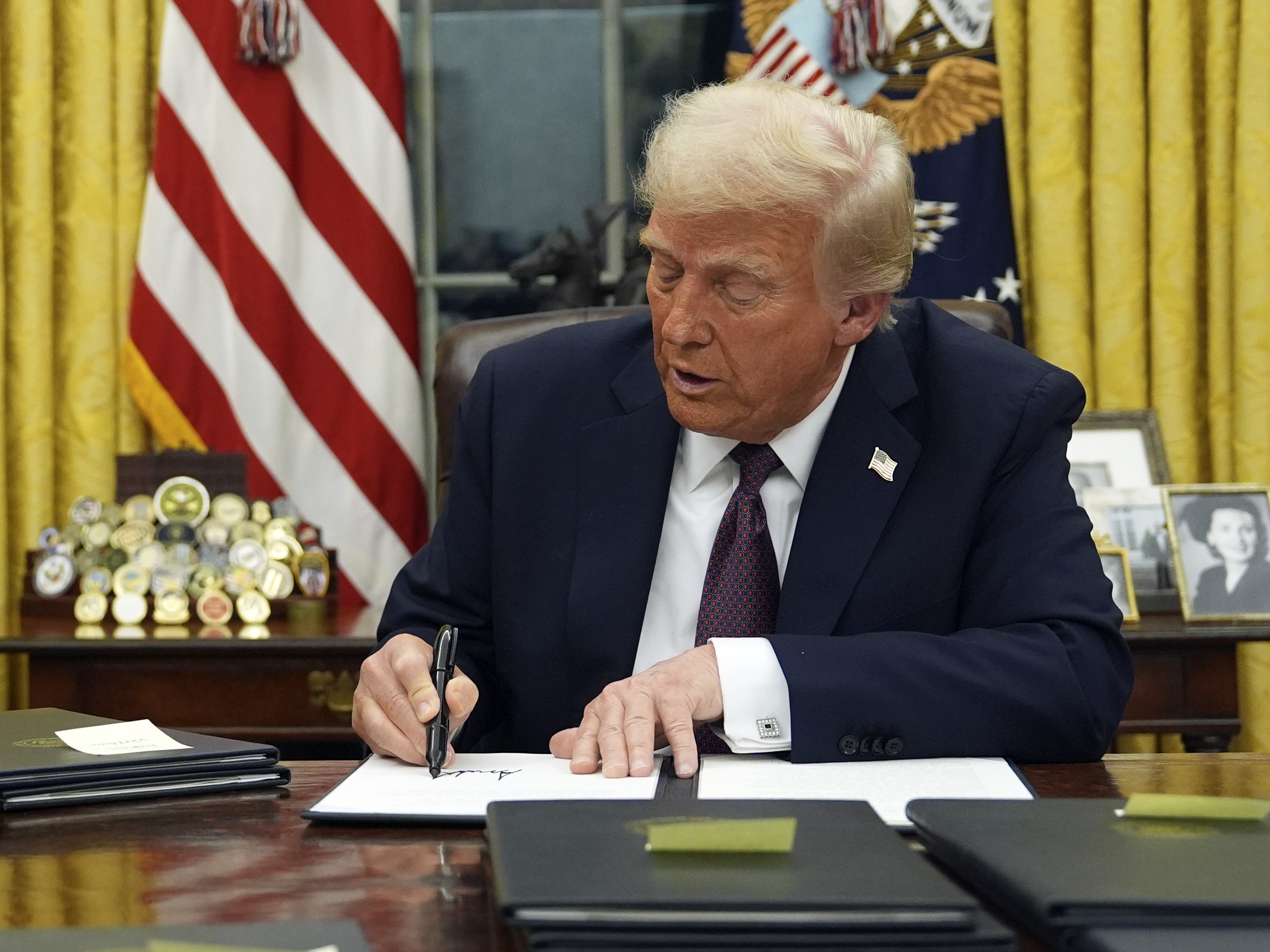 caption: President Donald Trump signed multiple executive orders after his inauguration on Monday, Jan. 20, 2025. He also declared a national energy emergency.
