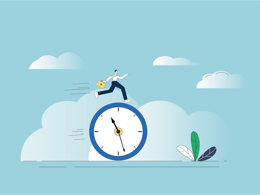 An office worker runs on top of a clock to signify returning to the workforce after time has passed.