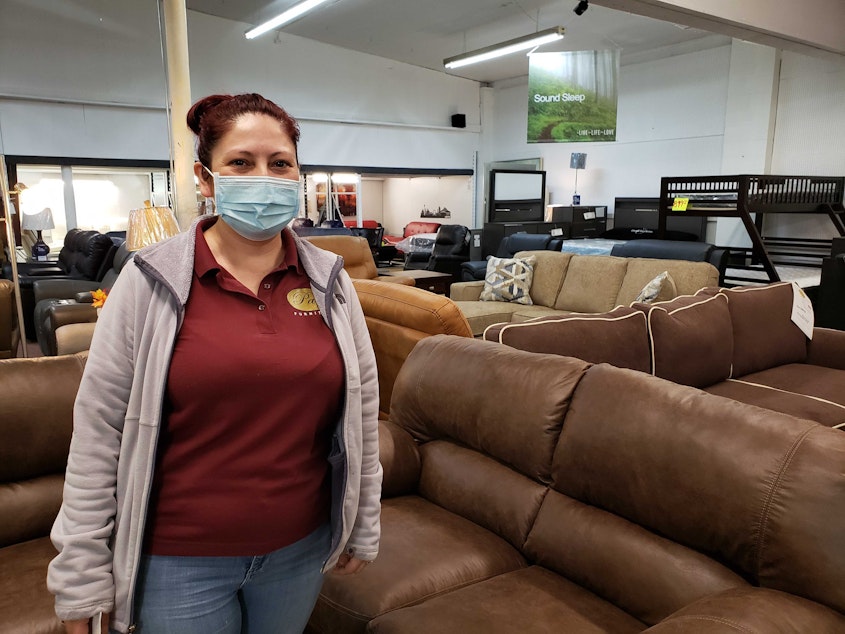 caption: Yoanna Campos says new neighbors means new customers at Paty Furniture on Saturday, February 5, 2022.